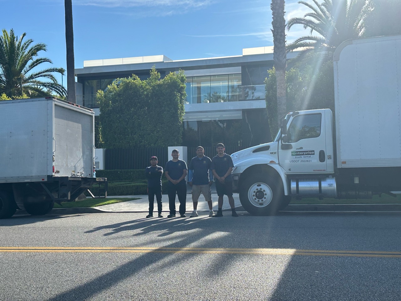 All In One moving crew with two trucks outside a Southern California home